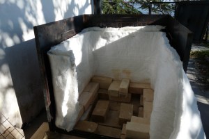 Adding solid metal side outside the grill and lining with fibre.